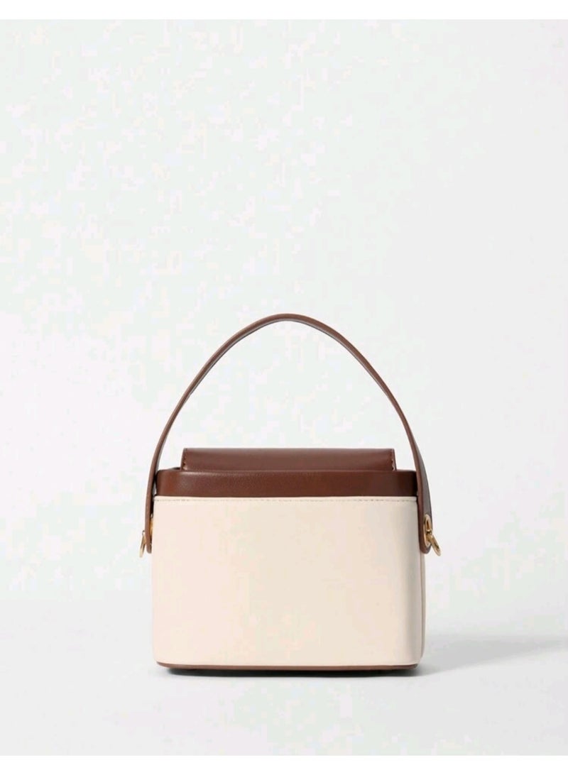 arab Women's handbag with a modern and elegant design. Features a chic beige and dark brown color combination with a gold-tone lock and adjustable shoulder strap. Perfect for daily use or special occasions, with a practical design that fits your essentials.  Dimensions: 10.5 cm (Height) × 17 cm (Width) × 13 cm (Depth)  Color: Beige and Brown  Gold-tone metal lock  Top handle and removable shoulder strap - Image 3
