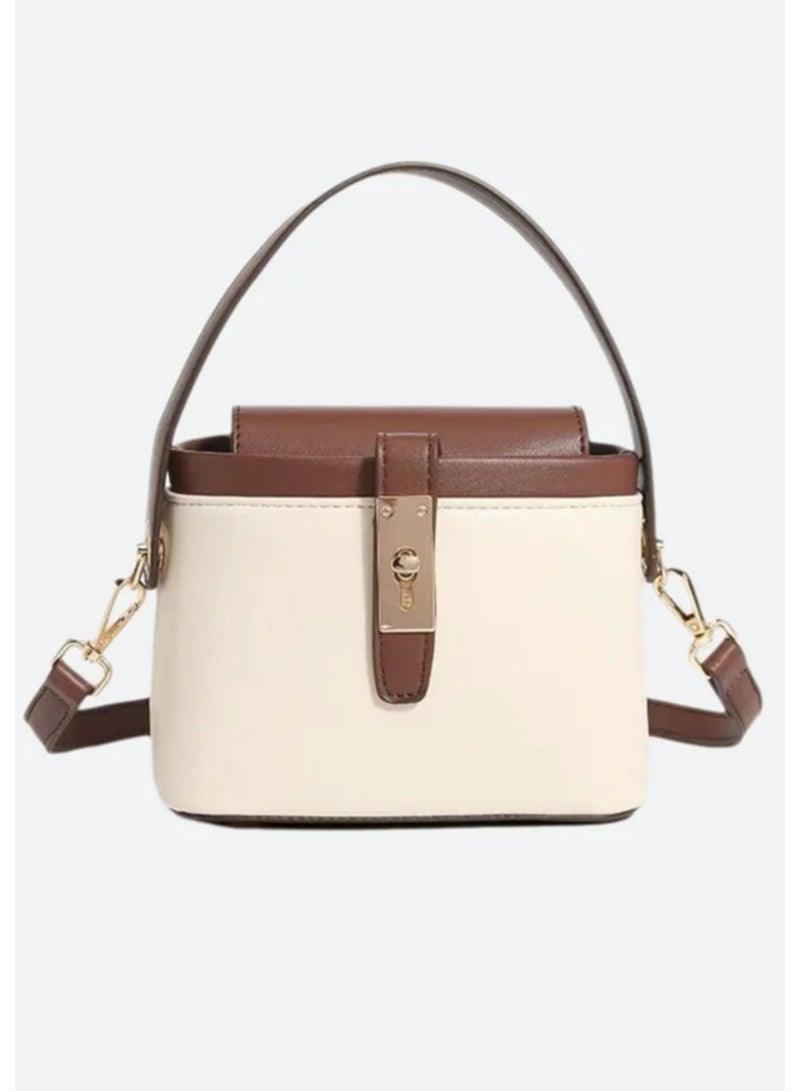 arab Women's handbag with a modern and elegant design. Features a chic beige and dark brown color combination with a gold-tone lock and adjustable shoulder strap. Perfect for daily use or special occasions, with a practical design that fits your essentials.  Dimensions: 10.5 cm (Height) × 17 cm (Width) × 13 cm (Depth)  Color: Beige and Brown  Gold-tone metal lock  Top handle and removable shoulder strap - Image 5