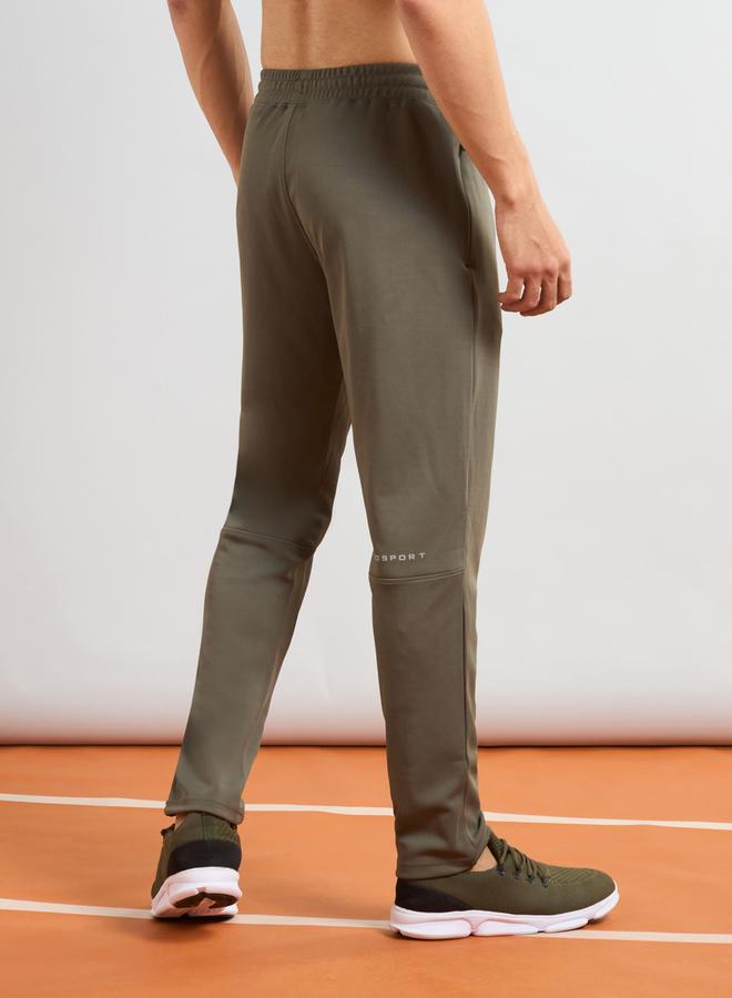 تكنوسبورت بنطلون رياضي تكوسبورت رجالي أخضر مطاطي بأربعة اتجاهات - Image 1