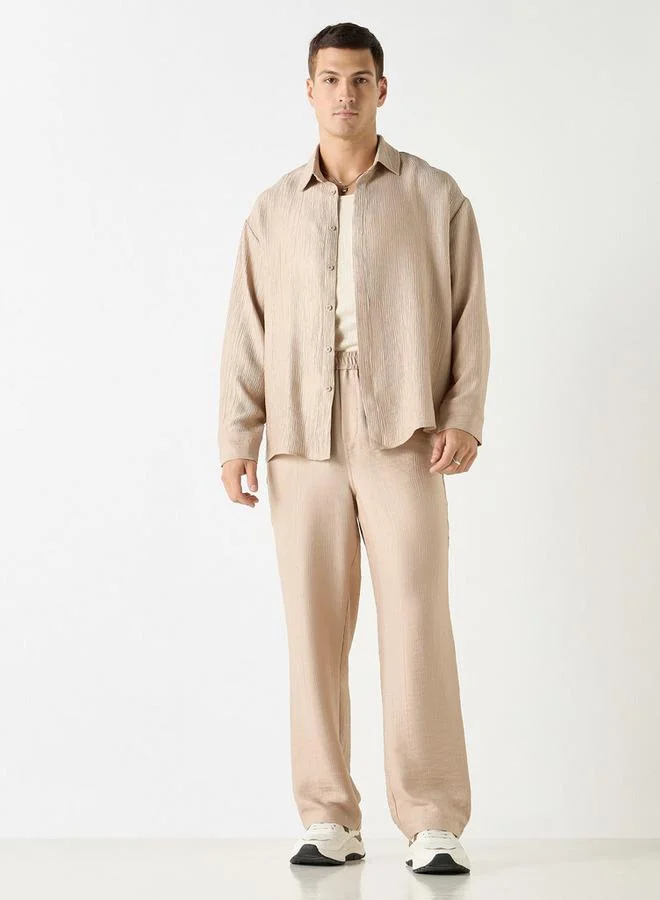 ايكونيك بنطلون بارز الملمس بقصة مريحة وخصر مرن وجيوب من آيكونيك