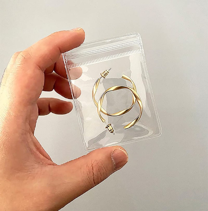 Fnuiddt 100 Pack PVC Clear Jewelry Anti Oxidation Zipper Bag Antitarnish Plastic Bags for Packaging Jewelry Rings Earrings Transparent Poly Pouch Clear 314472inch