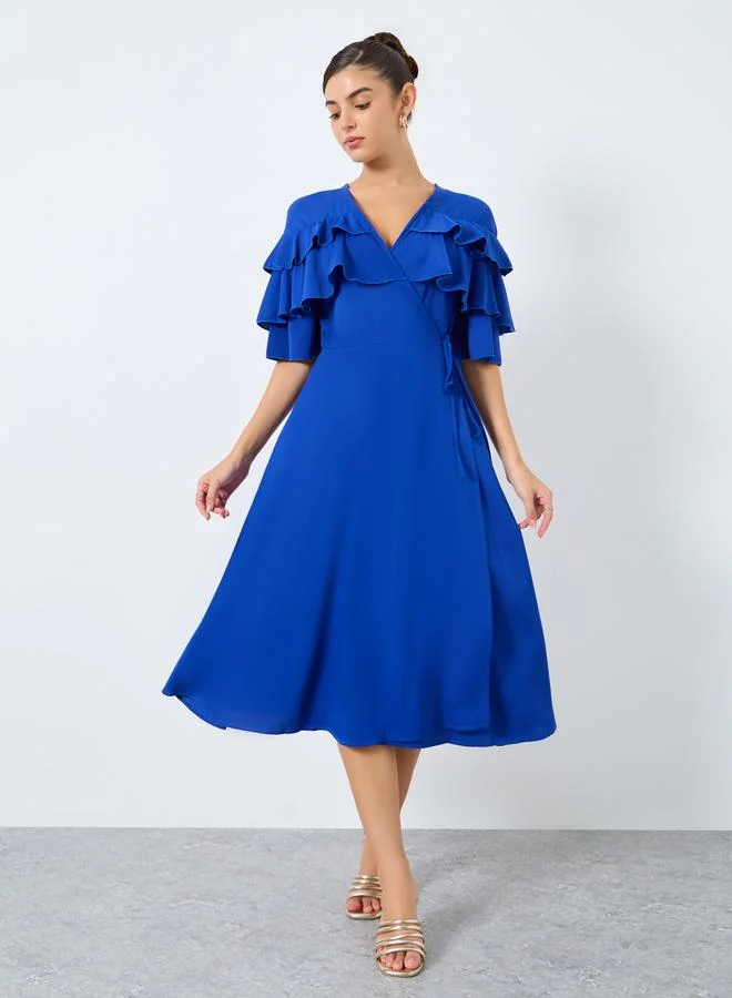 ستايلي فستان ميدي سادة بتفاصيل كشكش