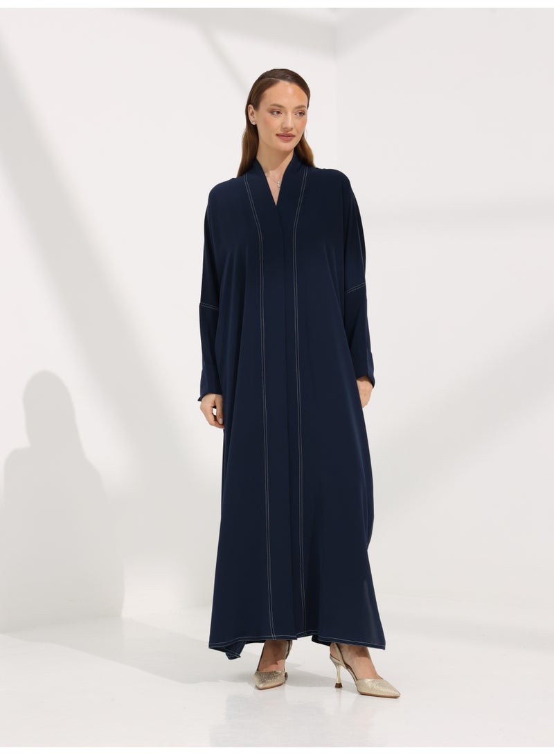 Khan&Co. Seven Seas Indigo indigo blue crepe fabric abaya with two silver KHAN&CO logo buttons - by Abdullah Khan - Image 1