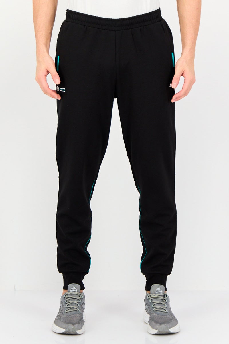 PUMA AMG Men Sportswear Fit Brand Logo Outdoor Sweatpants, Black - Image 1