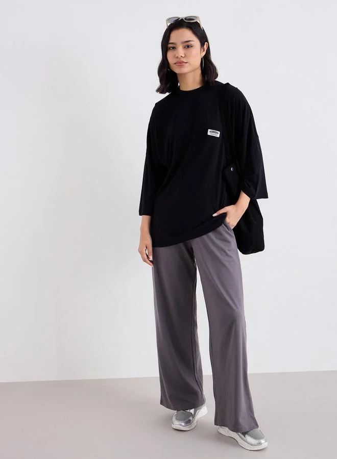 Styli Styli Black Oversized T-Shirt with Badge Detail