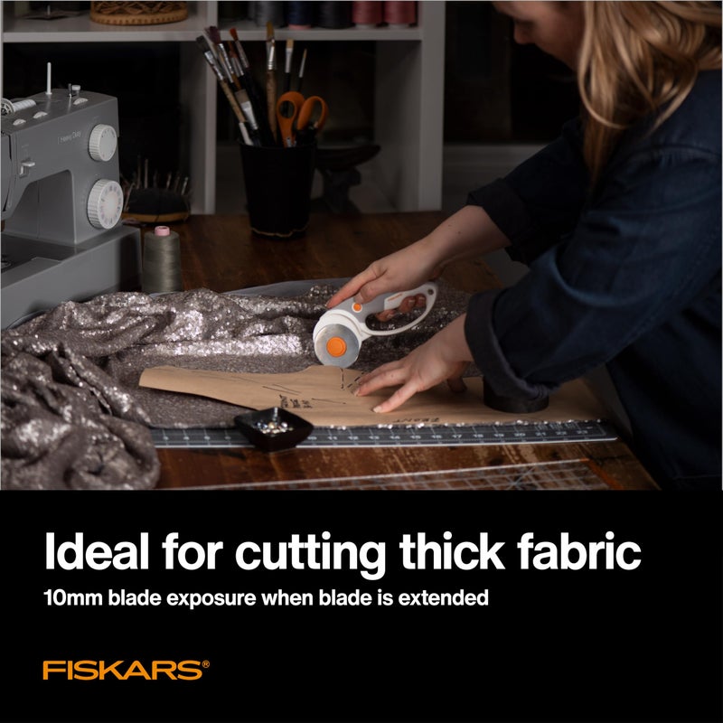 Fiskars 60mm Rotary Cutter for Fabric with Ergonomic Loop Grip And Comfort Handle, Titanium Rotary Fabric Cutter for Thick Materials, Easy and Safe Blade Change, Sewing Supplies and Quilting Tools - Image 3