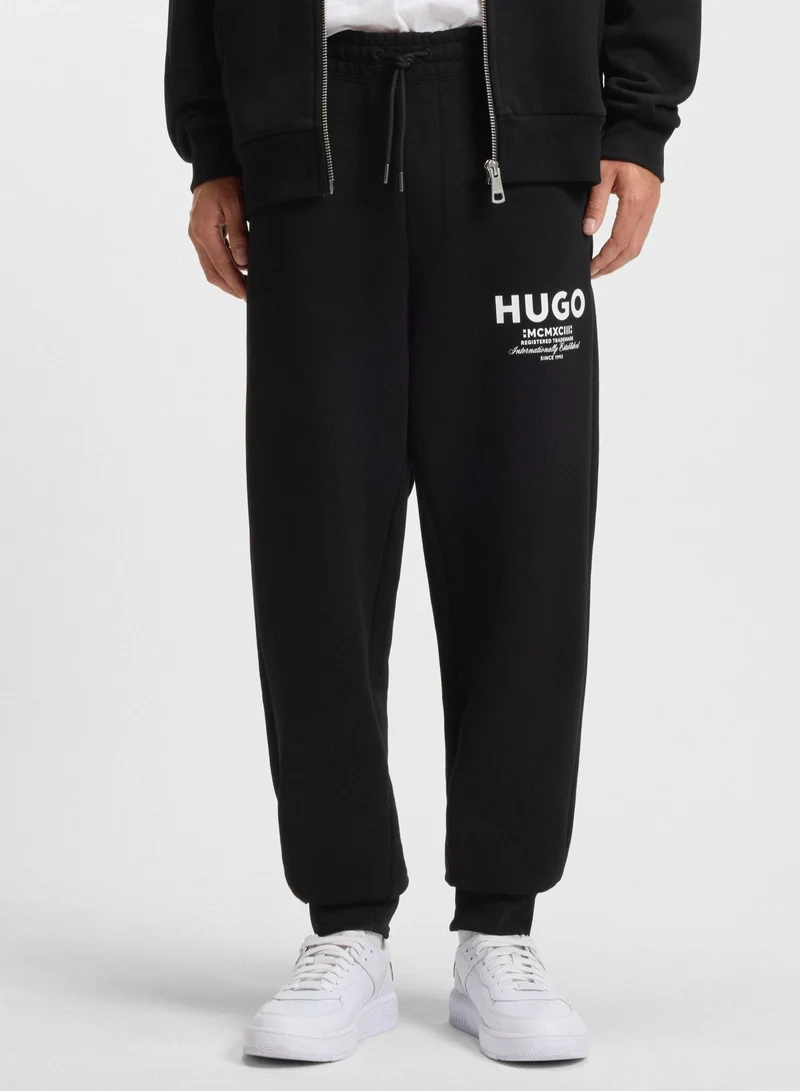 HUGO Cotton-terry tracksuit bottoms with logo print