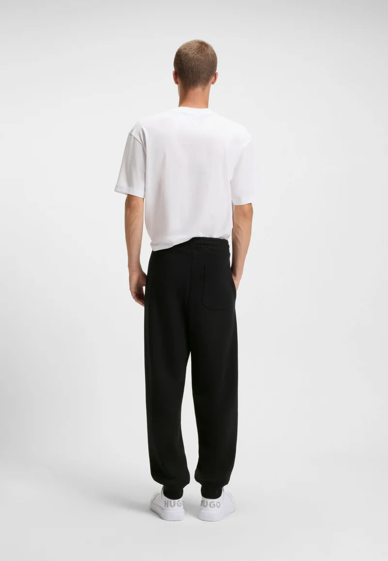 هوجو بنطلون رياضي قطني تيري بطبعة شعار