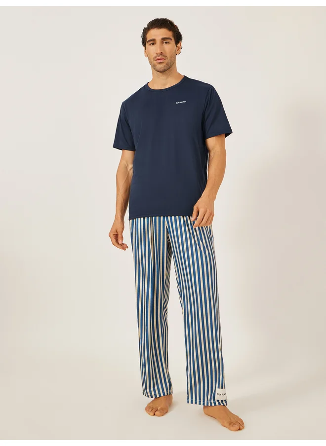Styli Styli Unwind Minimal Printed T-Shirt and Striped Badge Detail Pyjama Set