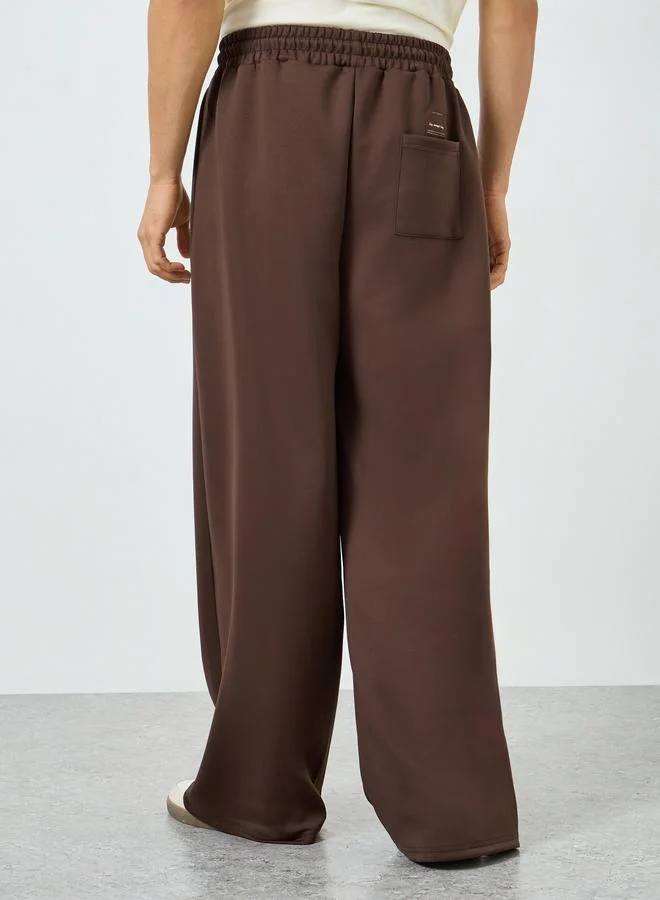 Styli  Men Brown Wide Leg Track Pants for Men | Best Price UAE