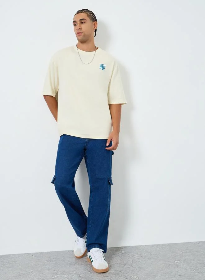 Styli Men Cream Graphic Print Oversized T-Shirt