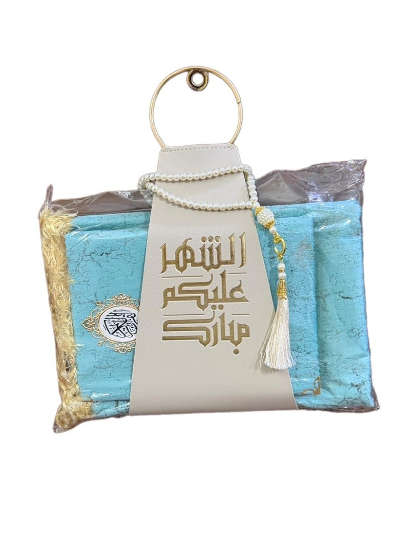 A prayer rug, a Quran, and prayer beads, presented with a suitable strap, as a Ramadan gift. - Image 1