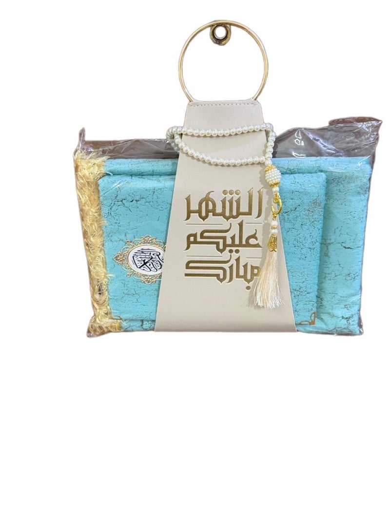 A prayer rug, a Quran, and prayer beads, presented with a suitable strap, as a Ramadan gift. - Image 2