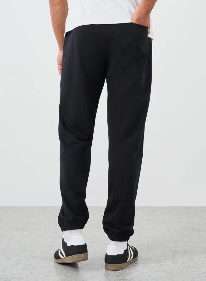 Styli Styli Typography Embossed Oversized Elasticated Cuffed Joggers