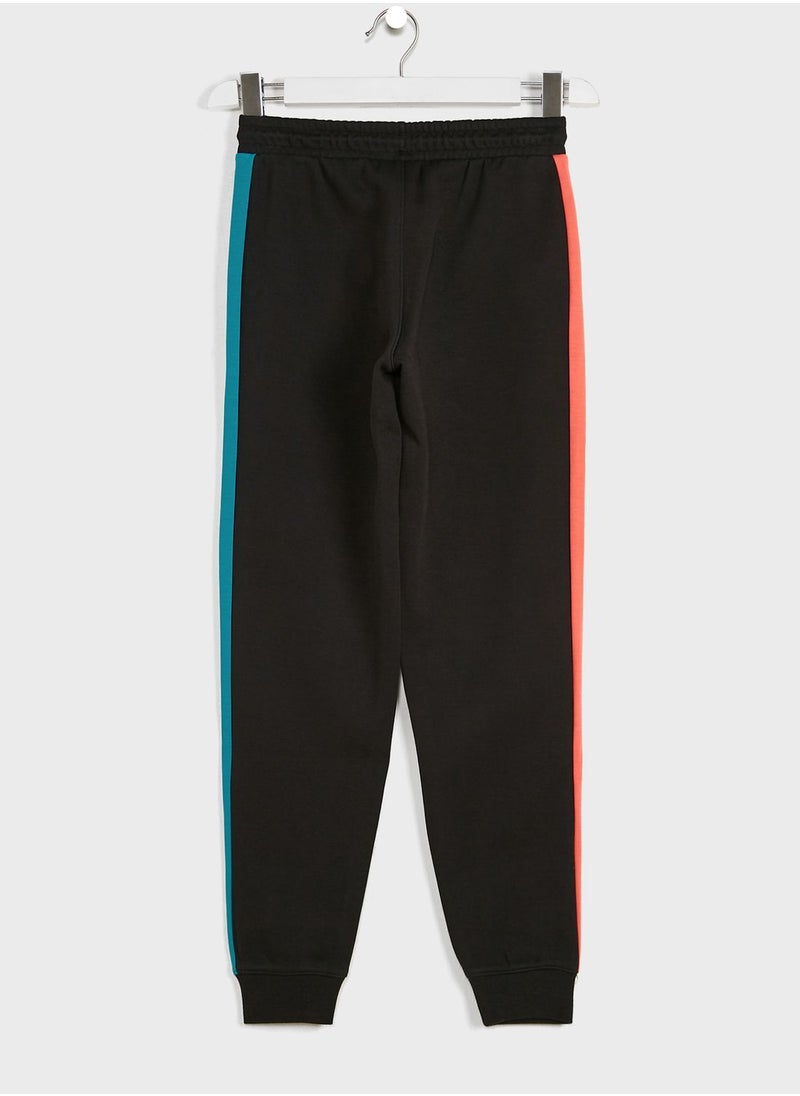 PUMA - Iconic T7 kids sweatpants - Image 1