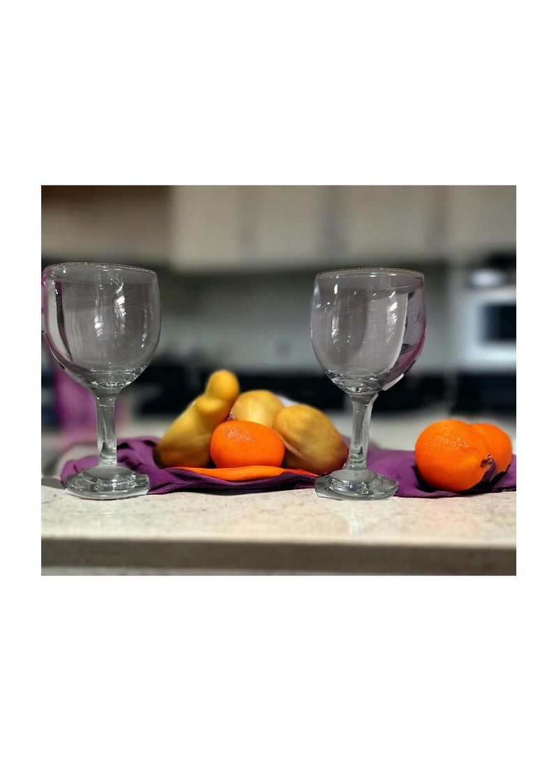 A set of juice glasses with a base 