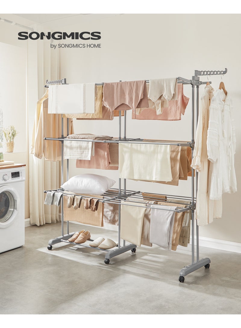 سونمجز منشر غسيل قابل للطي، 4 طبقات، ارتفاع 69.9 بوصة، قضبان قابلة للتمديد، مصنوع من الفولاذ المقاوم للصدأ، حامل ملابس دوار، منشر ملابس، للاستخدام الداخلي والخارجي، لون رمادي فاتح - Image 2