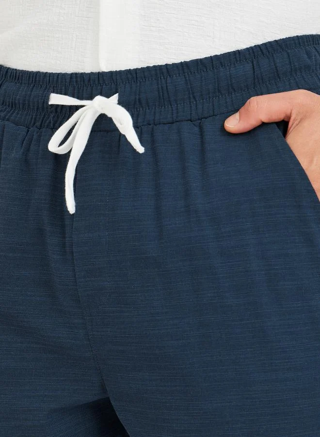 Styli Styli Men Navy Blue Textured Drawstring Regular Fit Pants