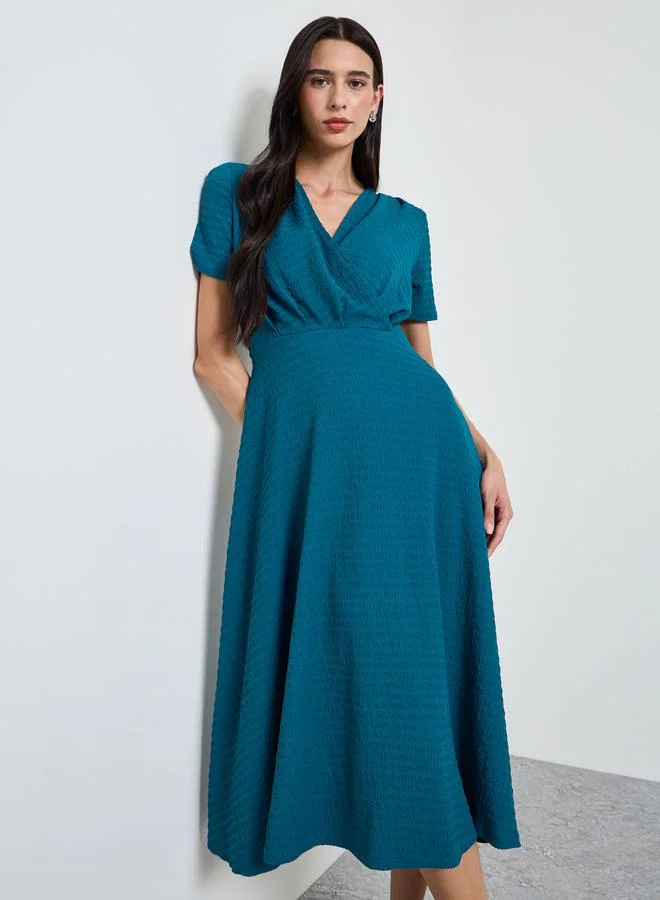 ستايلي Teal Textured V Neck A-Line Midi Dress