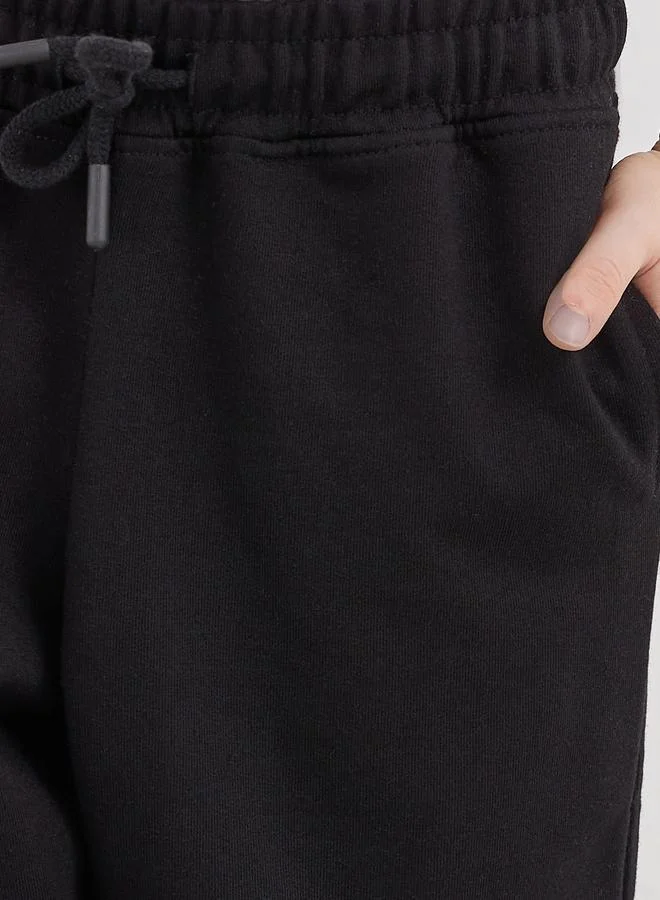 Styli Styli School Uniform Black Cotton Cuffed Joggers with Pockets