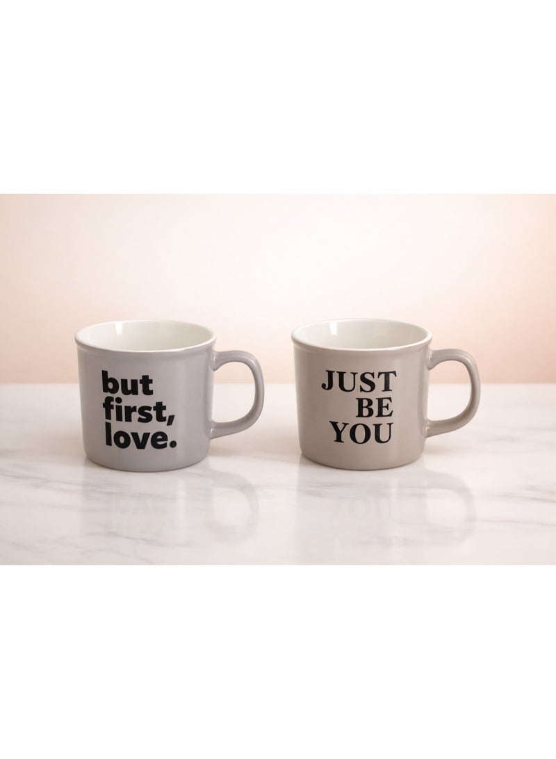 طقم أكواب قهوة سيراميك مينيماليست (عبوة من 2) مع طباعة 'But First, Love' و 'Just Be You'، رمادي/بيج محايد - Image 1