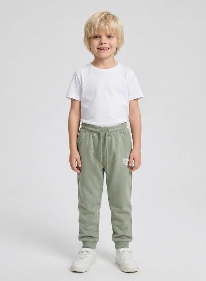 Boys Olive Graphic Print Cuffed Hem Drawstring Joggers By Juniorloom
