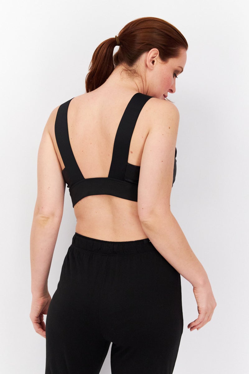 PUMA Women Brand Logo Training Sports Bra, Black - Image 4