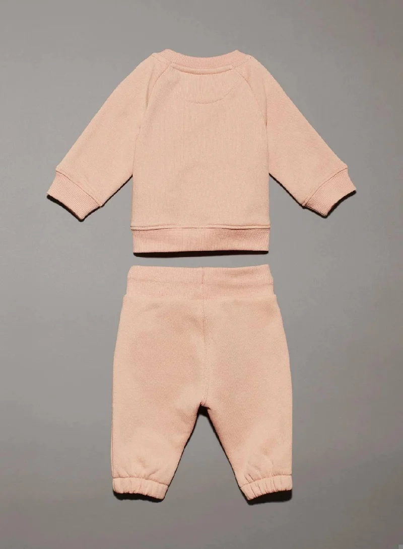 كالفن كلاين جينز بدلة رياضية للأطفال حديثي الولادة مزينة بشعار كلفن كلاين