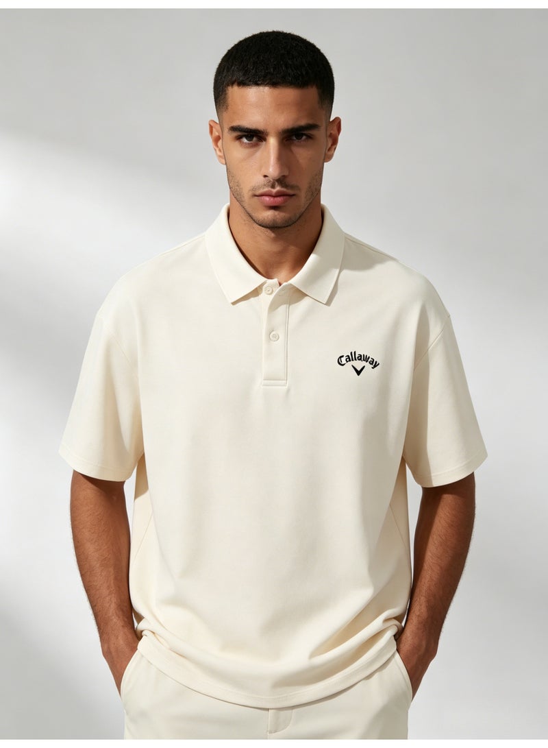 Callaway Men’s Cream Off White Short Sleeve Golf Polo Shirt with Black Printed Chest Logo - Image 1