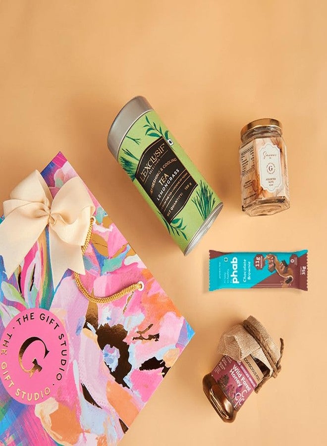 THE GIFT STUDIO.COM Wholesome Indulgence Gift Hamper | Healthy Snacks, Lemongrass Tea & Honey | Guilt-Free Gifting in Floral Bag - Image 2