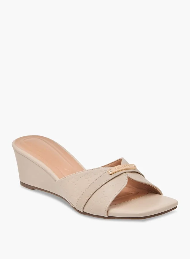 سيليست صنادل نسائية سهلة الارتداء بنقش المونوغرام وكعب ويدج