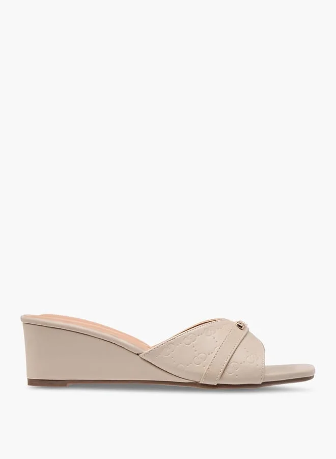 Celeste Women's Monogram Embossed Slip-On Sandals with Wedge Heels