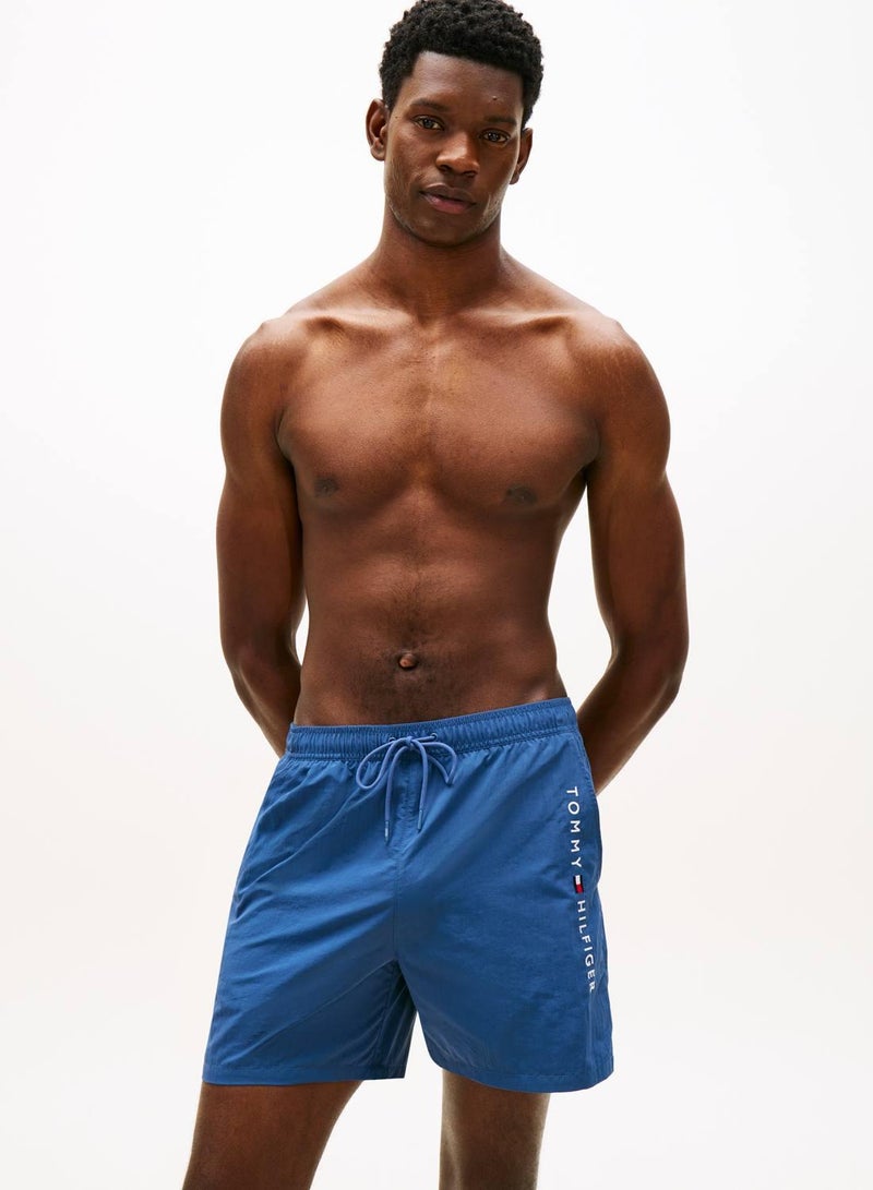 TOMMY HILFIGER Original Logo Mid Length Swim Shorts - Image 1