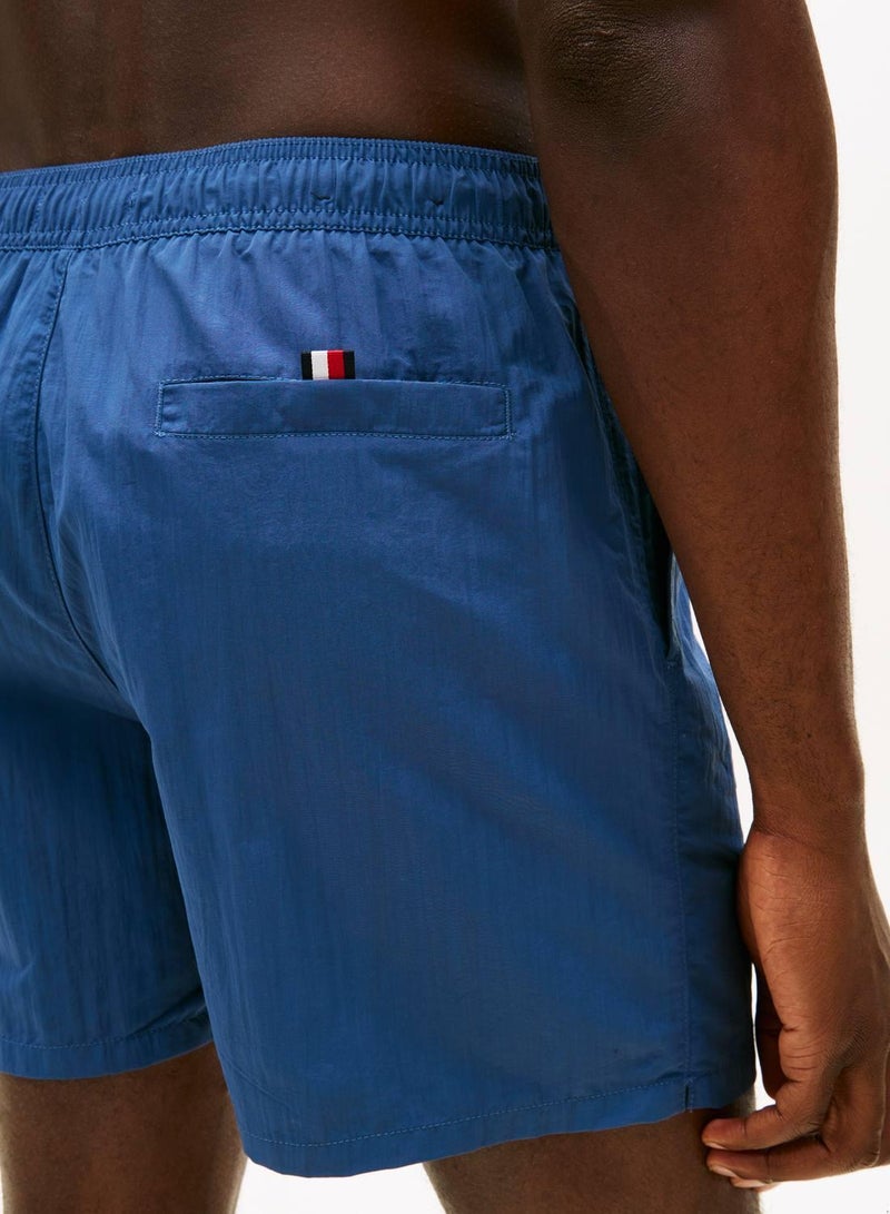 TOMMY HILFIGER Original Logo Mid Length Swim Shorts - Image 4