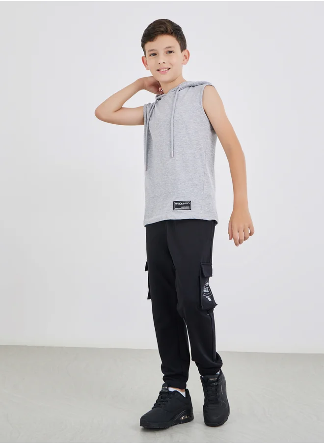 ستايلي Styli Badge Detail Sleeveless Hooded T-Shirt