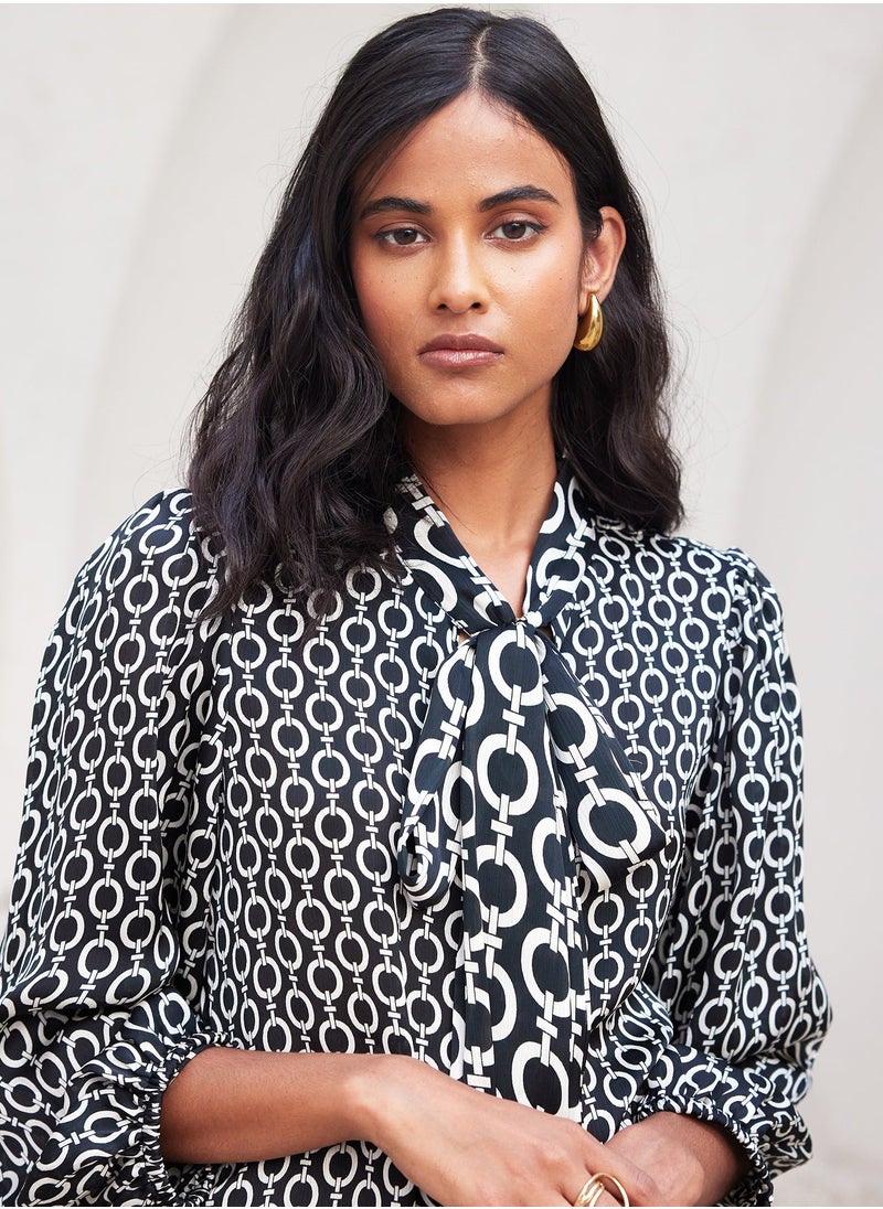 Salt Attire - Trendy Geometric Pattern Top with Stylish Tie-Up Neckline and Full Length Blouson Sleeves Perfect for Chic Everyday Wear and Special Occasions - Image 1