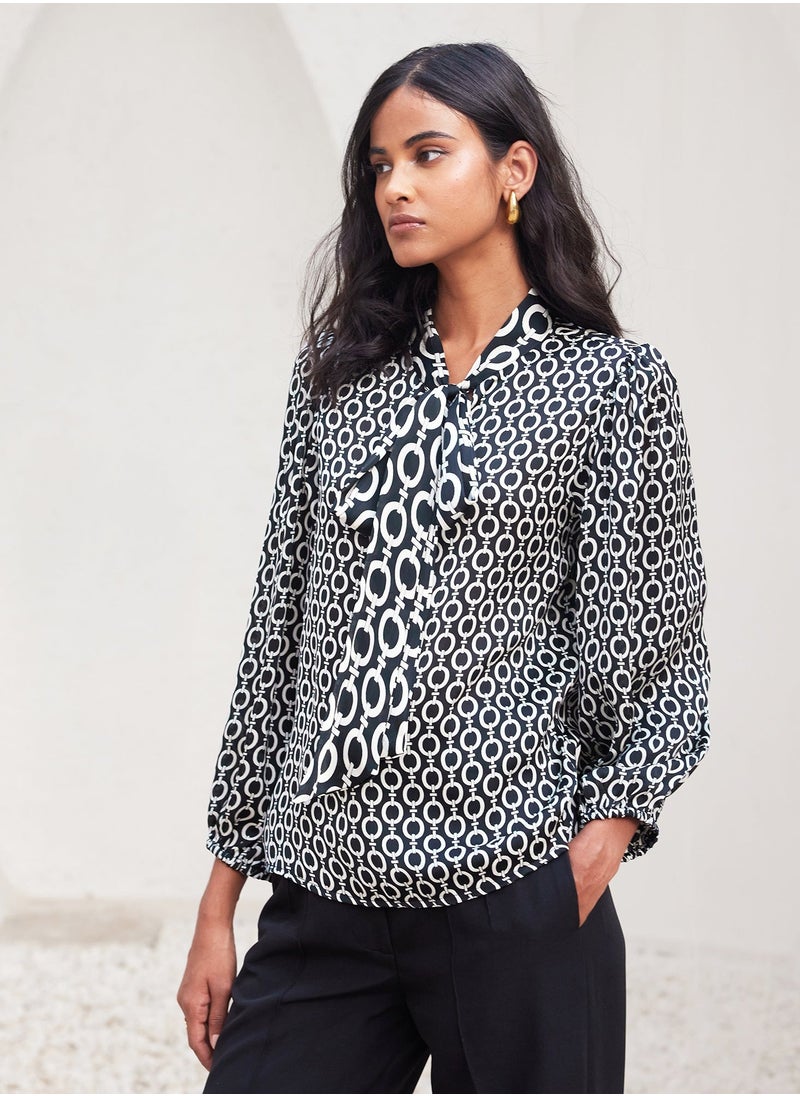Salt Attire - Trendy Geometric Pattern Top with Stylish Tie-Up Neckline and Full Length Blouson Sleeves Perfect for Chic Everyday Wear and Special Occasions - Image 1