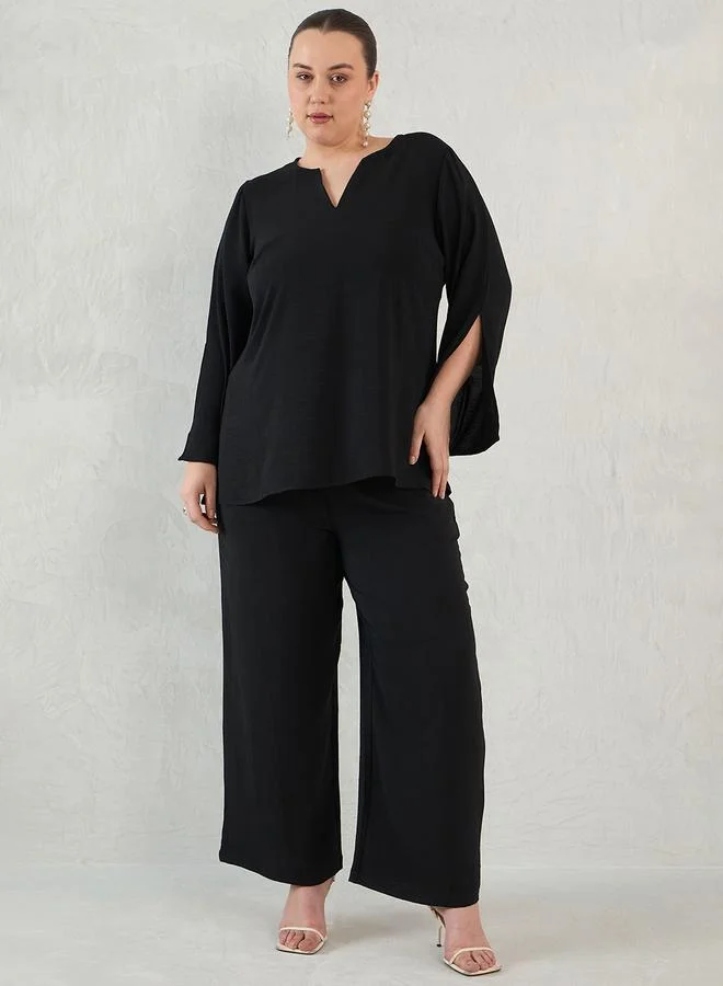 فيميلا طقم منسق بمقاس كبير من بنطال وبلوزة بقصة مريحة