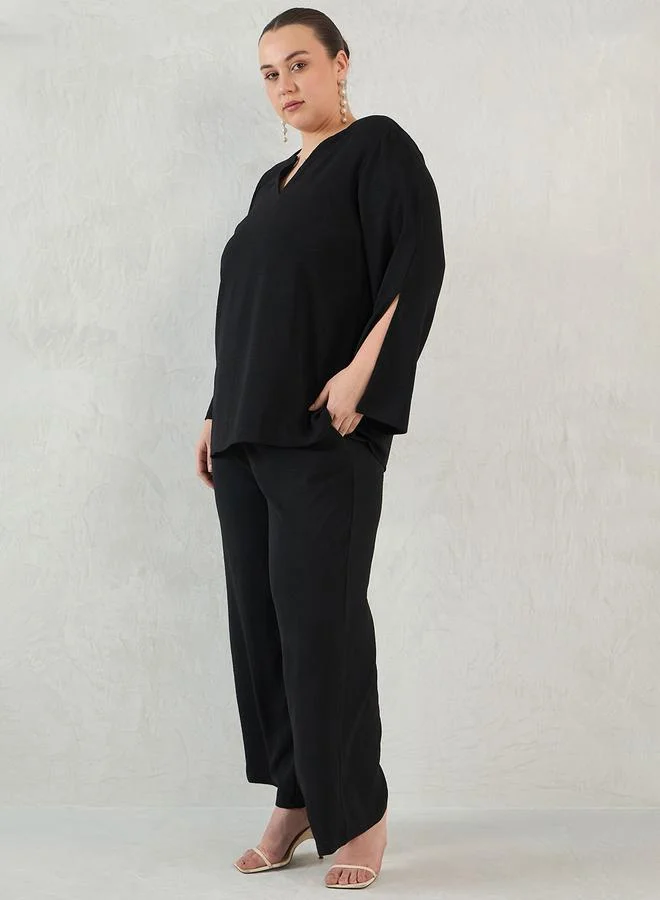 فيميلا طقم منسق بمقاس كبير من بنطال وبلوزة بقصة مريحة