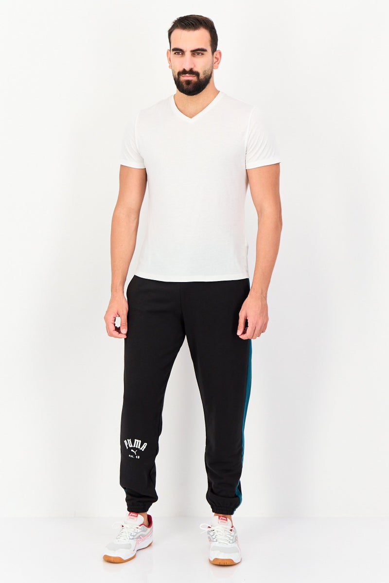 PUMA Men Sportswear Fit Brand Logo Outdoor Sweatpants, Black - Image 4