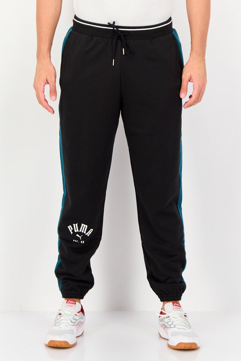 PUMA Men Sportswear Fit Brand Logo Outdoor Sweatpants, Black - Image 1