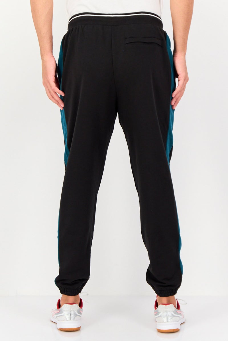 PUMA Men Sportswear Fit Brand Logo Outdoor Sweatpants, Black - Image 2