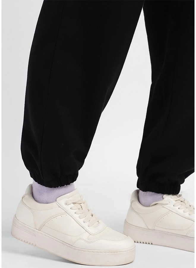 جونبيري سراويل جوجر قطنية نقية للنساء باللون الأسود من جوني بيري