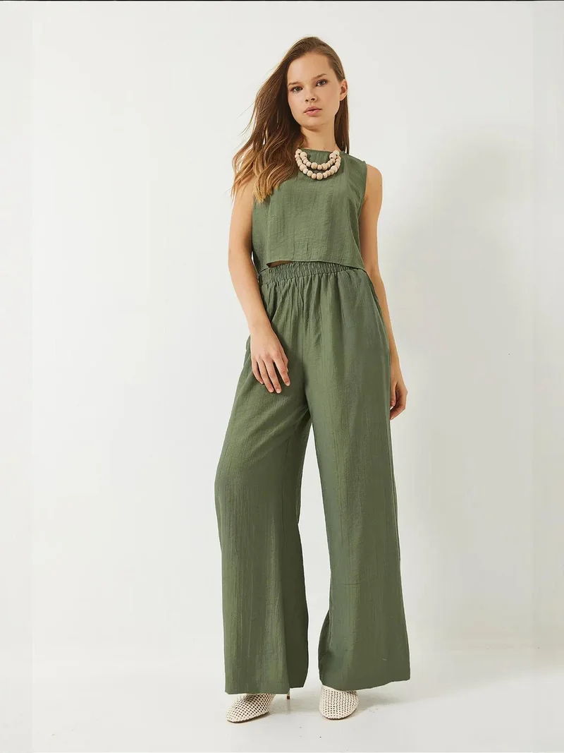 بيانكو لوتشي طقم تي شيرت قصير بخصر عالٍ وبنطلون واسع الساق من لوكسي