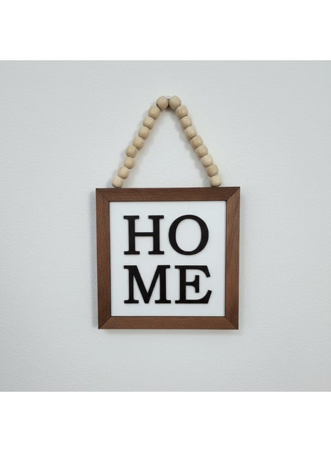 A unique wooden plaque featuring the word HOME, measuring 20x20 cm, made from premium 10mm thick Spanish MDF wood, adding beauty and elegance to your home, kitchen, or coffee corner.