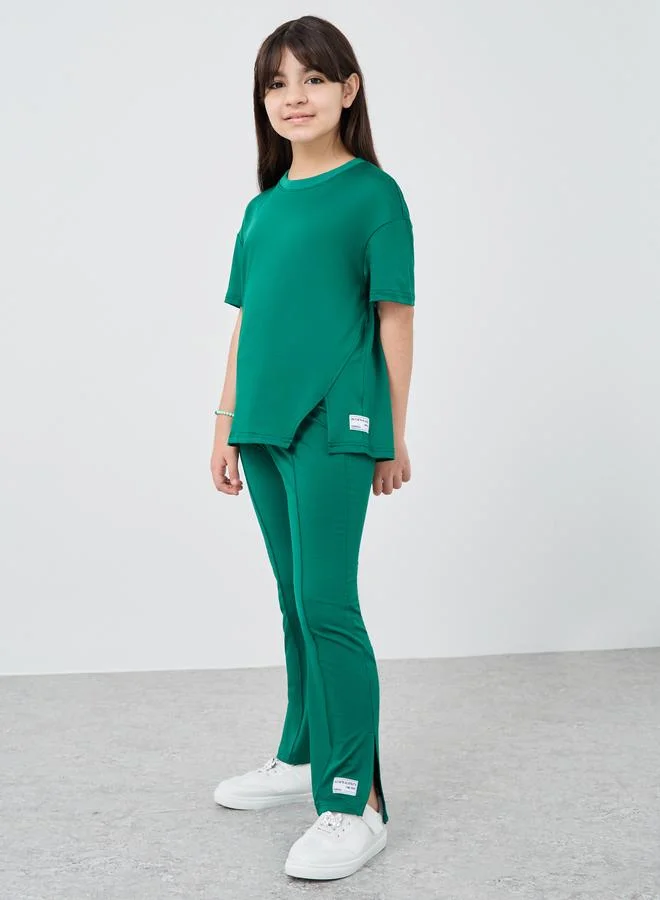 ستايلي Styli Patch Detail Oversized T-Shirt and Flared Leggings Set