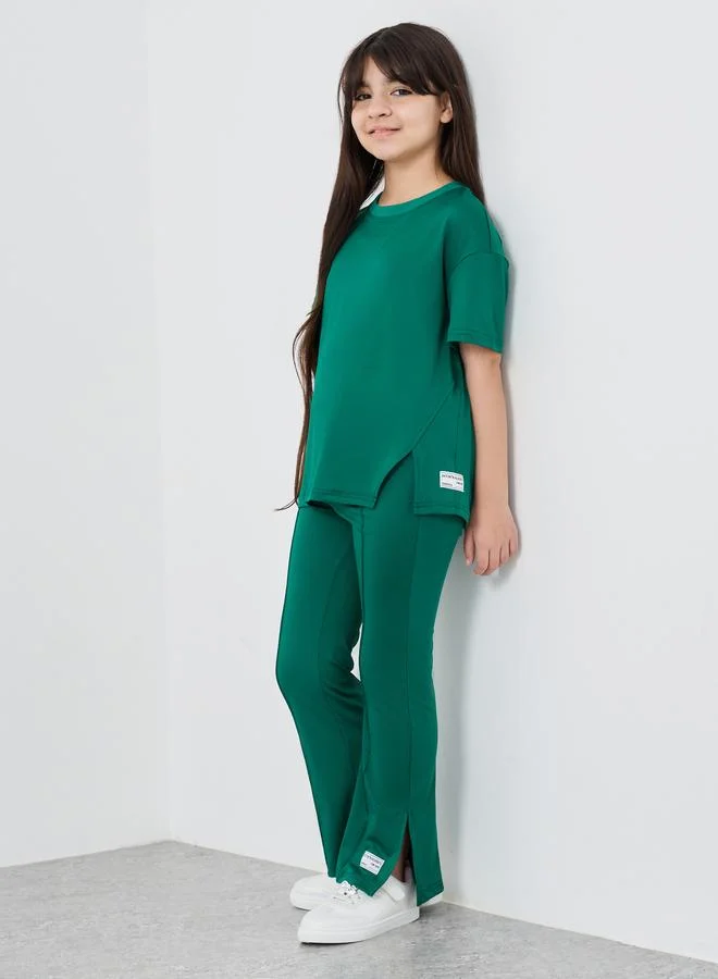 ستايلي Styli Patch Detail Oversized T-Shirt and Flared Leggings Set