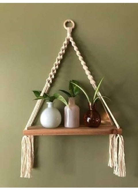 A stylish macramé boho shelf that blends simplicity with nature! 🌿💫 Perfect for displaying plants, candles, or your favorite decor pieces, adding warmth and modern charm to your home. 🏡✨