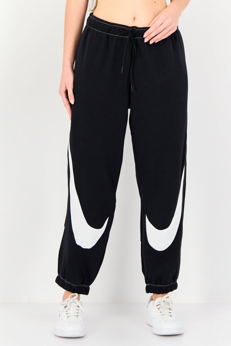 Nike Women Standard Fit Outdoor Sweatpants, Black - Image 1