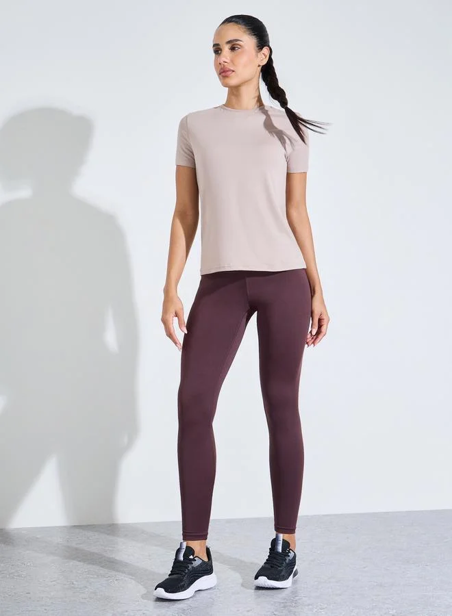 Styli Active Beige Solid Crew Neck Back Peep Active Top
